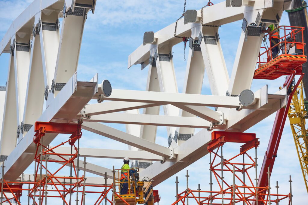 Workers on a construction site. Engineering and architectural infrastructure. Workplace
